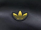 jaqueta Adidas preta de couro sintético