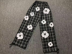 Calça xadrez Denim Tears