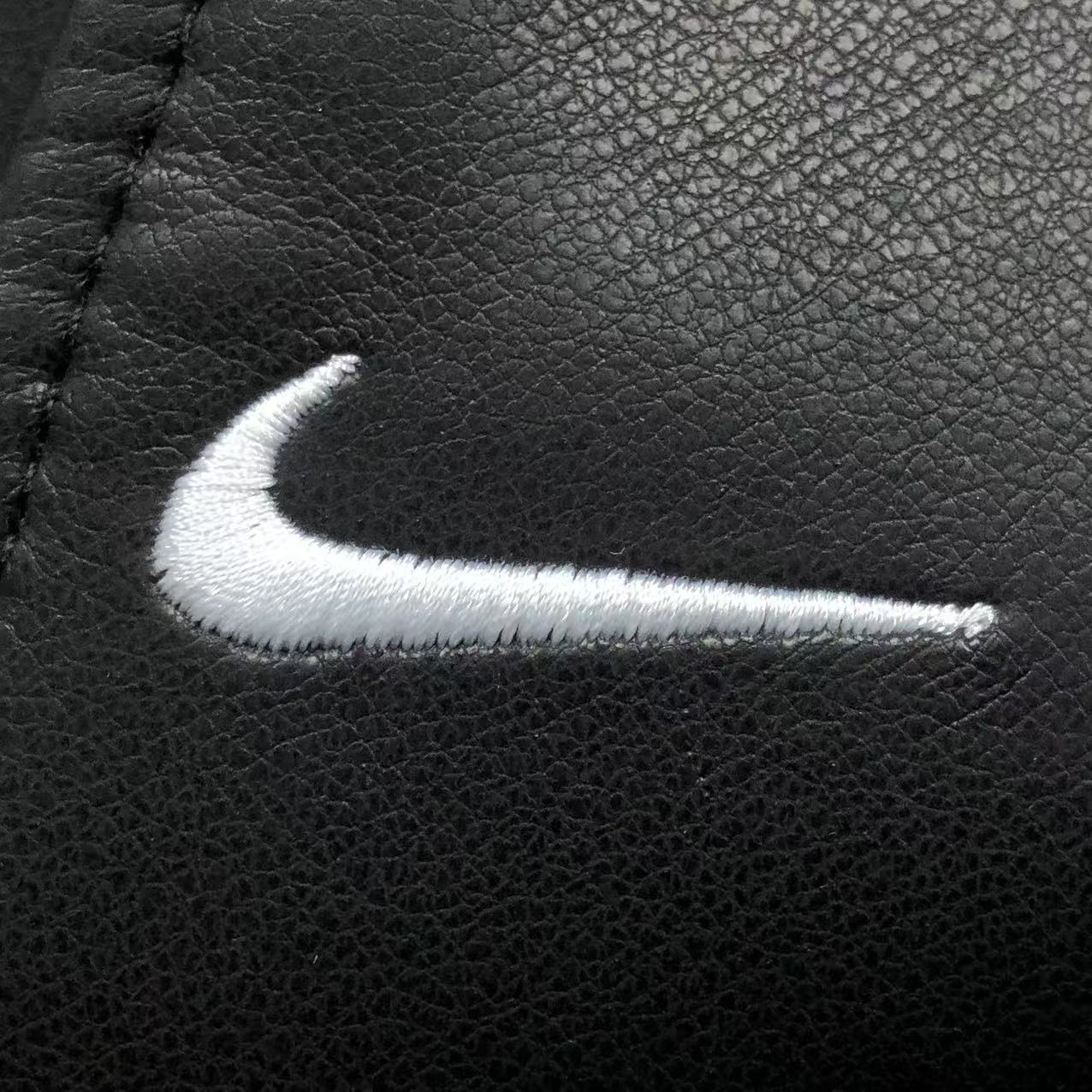 jaqueta varsity de couro Supreme x Nike