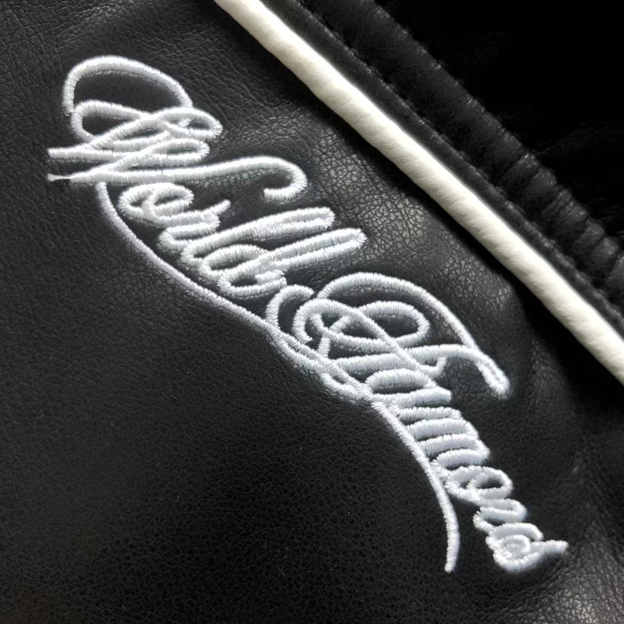 jaqueta varsity de couro Supreme x Nike