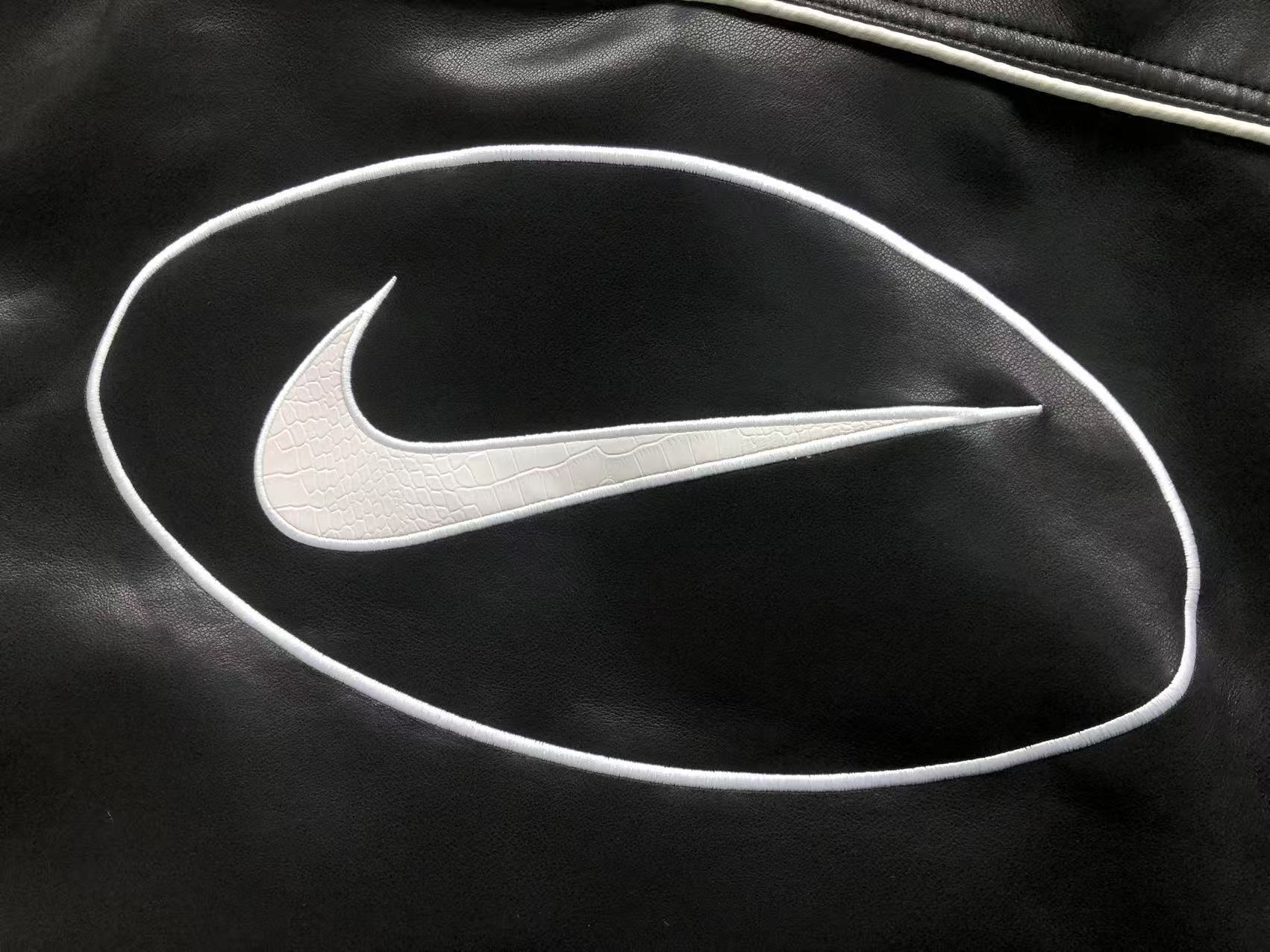 jaqueta varsity de couro Supreme x Nike